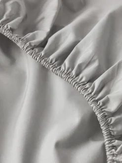 Prześcieradło z gumką z pranej mikrofibry jasne szare 90x200 + 26 cm zakładki